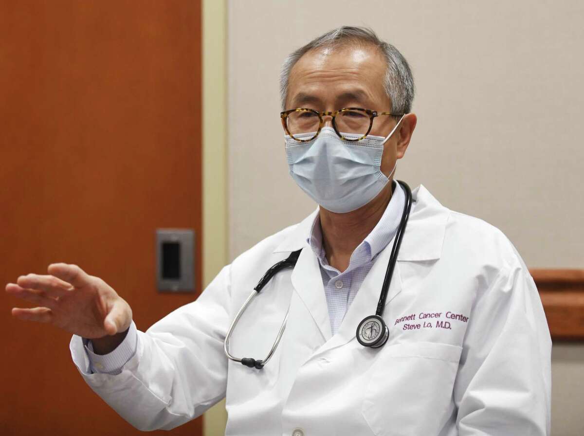 Oncologist Dr. Steve Lo chats at Stamford Hospital in Stamford, Conn. Monday, Dec. 20, 2021.