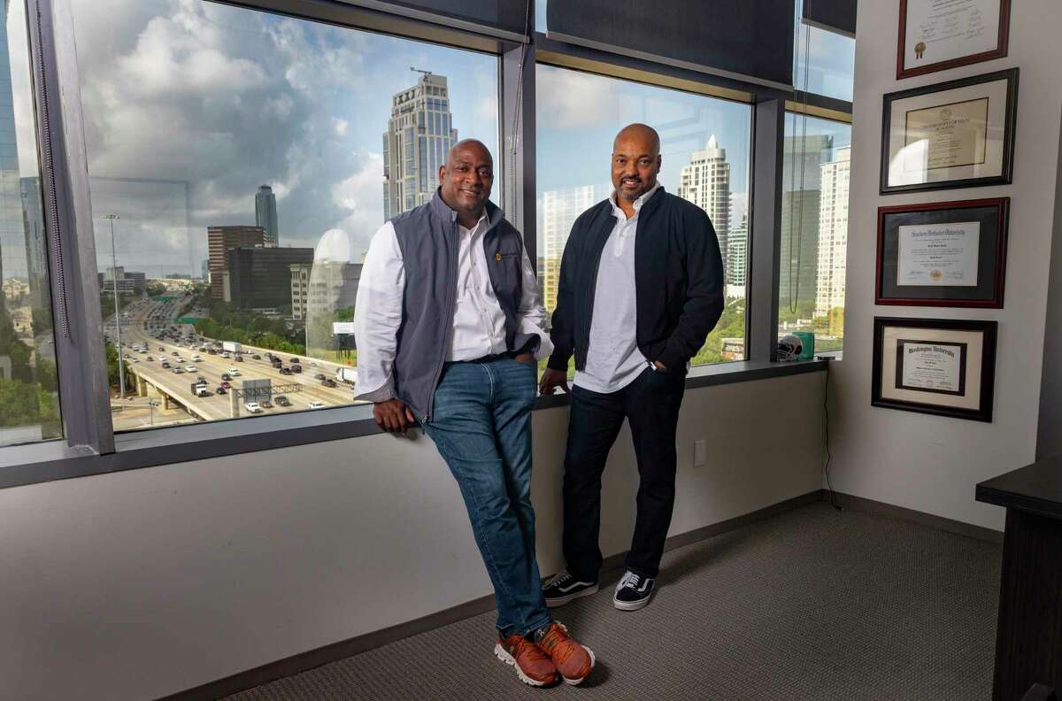 President Keith Smith, left, and CEO Mark Walker, right, the founders of Direct Digital Holdings, at their Galleria-area offices in Houston.