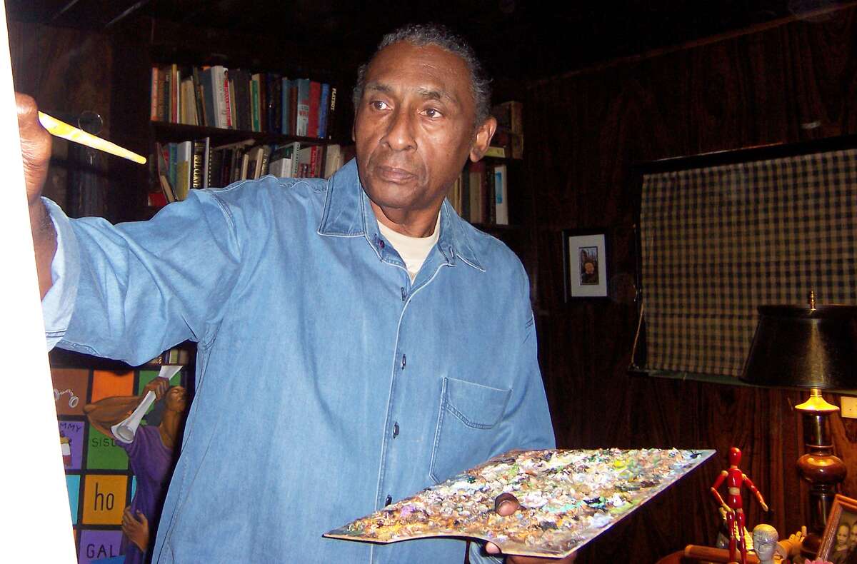 This 2007 photo shows artist Ernie Barnes, a former NFL player at his home in Los Angeles. He died in 2009 at age 70. 