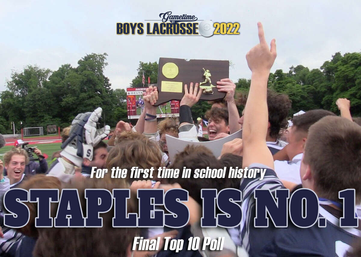 Staples' boys lacrosse team hoists their Class L championship trophy for the first time after defeating Darien 12-3 Sunday, June 12, 2022 at Sacred Heart University's Campus Field.