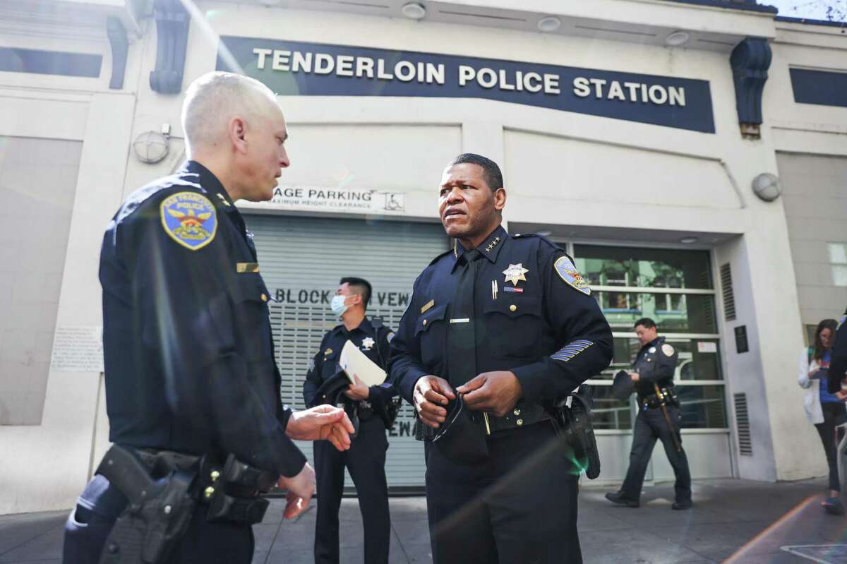 San Francisco Police Chief William Scott (right) chats with Deputy Chief David Lazar (left) outside the Tenderloin Police Station on Wednesday, March 16, 2022 in San Francisco, California. The Tenderloin Station got 20 more officers pulled from across the city to help with policing the neighborhood.