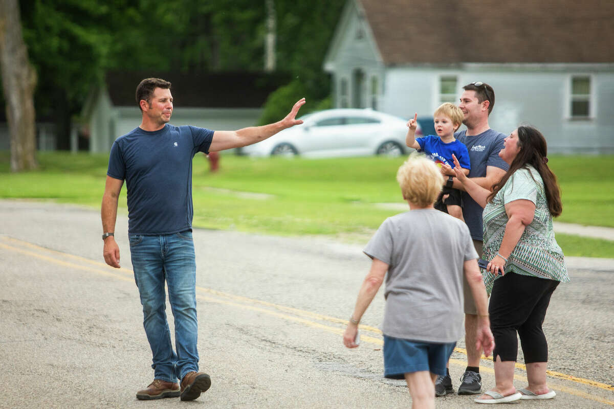 Fans greet Tom Bury, construction manager on "Restaurant: Impossible," left, as the crew films the grand reopening of Leah's Korner Kafe Tuesday, June 14, 2022 in Coleman.