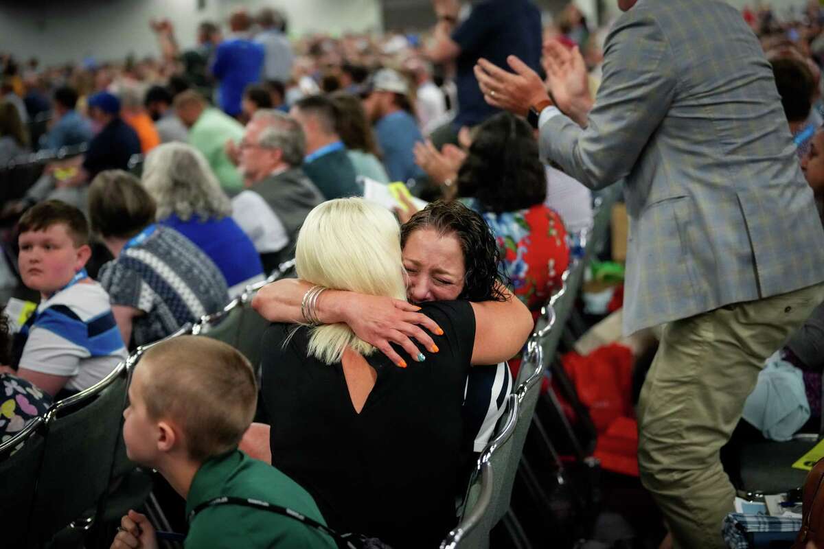 Jules Woodson hugs Tiffany Thigpen after Southern Baptists voted overwhelmingly to adopt reforms proposed by the sexual abuse task force aiming to combat abuse during the 2022 SBC Annual Meeting on Tuesday, June 14, 2022, at the Anaheim Convention Center in Anaheim.