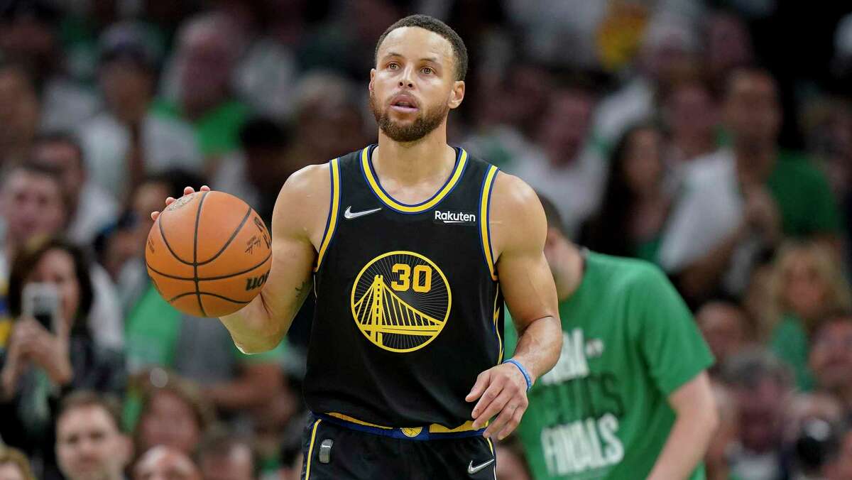Golden State Warriors guard Stephen Curry (30) brings the ball up court during Game 4 of basketball's NBA Finals against the Boston Celtics Friday, June 10, 2022, in Boston. (AP Photo/Steven Senne)