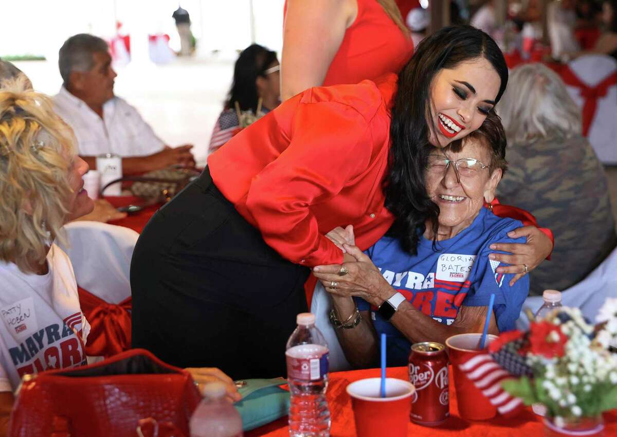Republican Mayra Flores gives a hug to supporter Gloria Bates as she awaits election results against Democrat opponent Dan Sanchez for Congress in Texas District 34 on Tuesday, June 14, 2022.