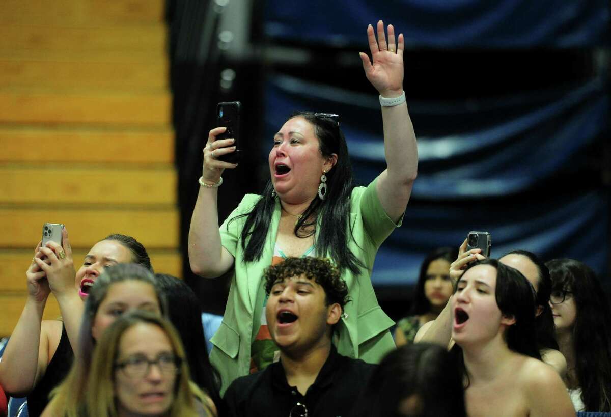 Fabiana Ferreira cheers as her son Rafael Ferreira gets his degree during Henry Abbott Technical High School Class of 2022 Commencement held at WCSU's O'Neill Center in Danbury, Conn., on Tuesday June 14, 2022.