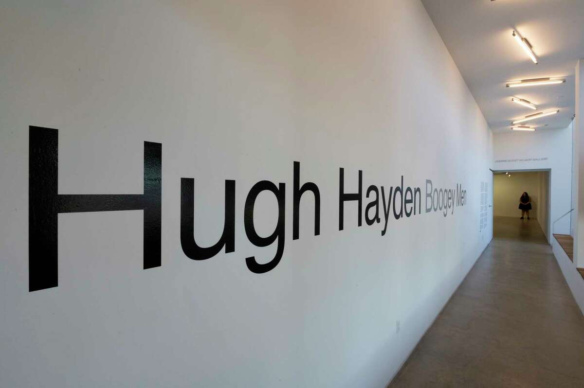 Hugh Hayden’s name leads people to the entrance of his new exhibit at the opening reception for Boogey Men in University of Houston’s Blaffer Art Museum Friday, June 10, 2022, in Houston.