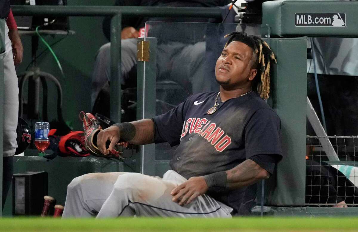Cleveland Guardians' Jose Ramirez leans against a rail after he was caught trying to steal third base during the 10th inning of the team's baseball game against the Colorado Rockies on Tuesday, June 14, 2022, in Denver. (AP Photo/David Zalubowski)