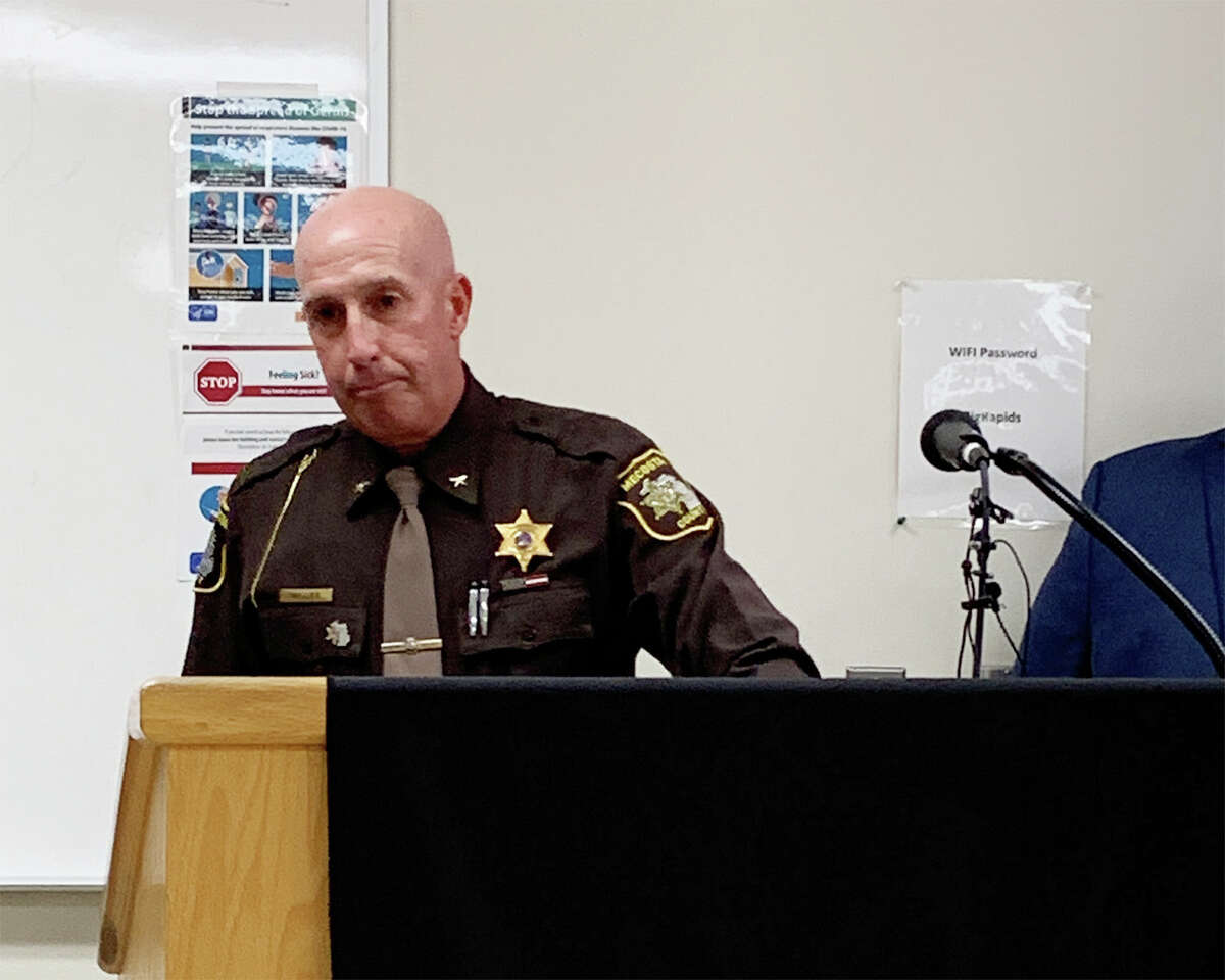 Mecosta County Sheriff Brian Miller pauses during a news conference Wednesday, June 15, where he and Mecosta County Chief Prosecutor Amy Clapp announced multiple charges against Charles Gillard in the shooting deaths of his wife and three children.