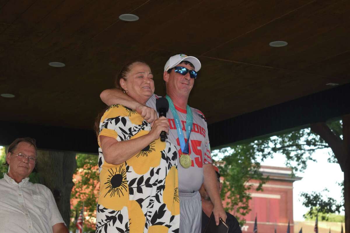 Ryan Peacock hugs his mother, Tammy Kost Dodds, during a ceremony to honor his achievements during the Special Olympics 2022 USA Games.