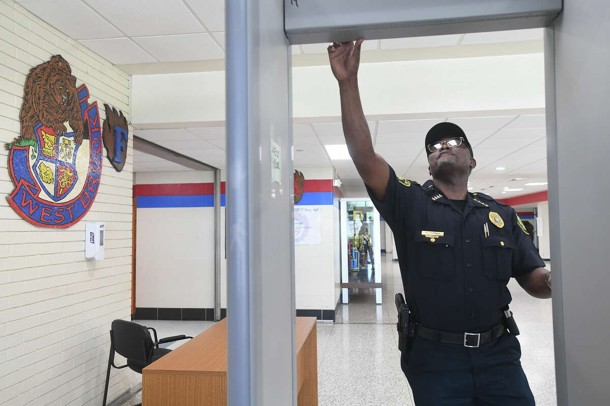 Beaumont ISD Police Chief Joseph Malbrough turns on a metal detector at West Brook High School as he talks about the safety measures in place at schools. Photo made Wednesday, June 15, 2022. Kim Brent/The Enterprise