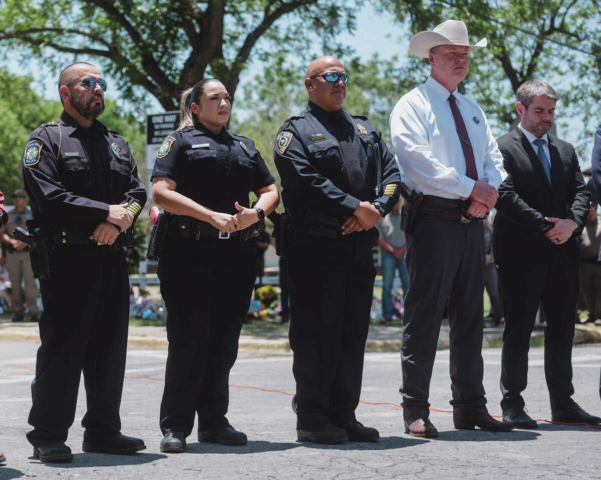 The police Chief Pedro Arredondo, third from right, of Uvalde, Texas, where a gunman killed 19 children and two teachers, at a news conference in the city on May 26, 2022. Law enforcement officers have questioned Arredondo?•s order to hold off on storming the two adjoining classrooms at Robb Elementary School, where the gunman had already fired more than 100 rounds. (Christopher Lee/The New York Times)