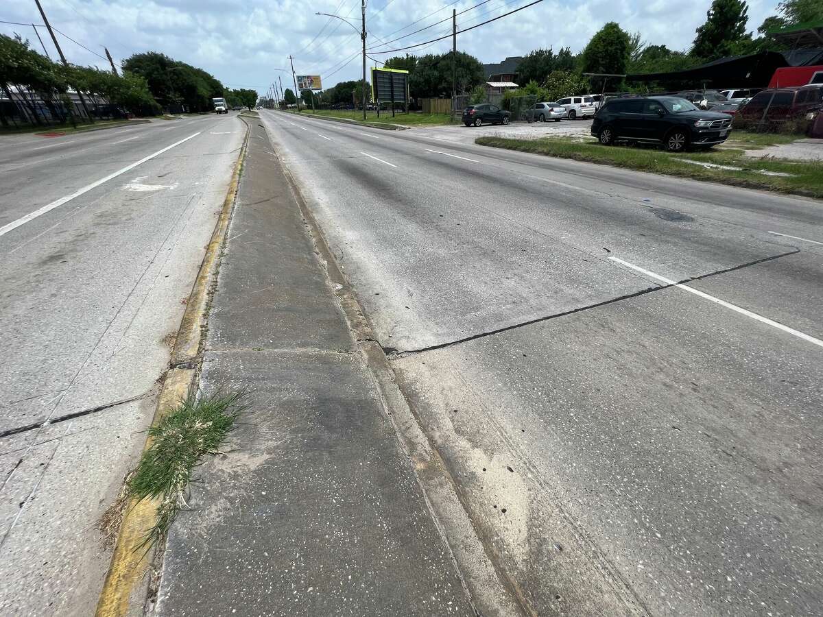 A witness told Chron 13-year-old Kameron Duckworth was struck by a hit-and-run driver near where this patch of grass is growing through the curb at the intersection of East Little York and Nordling streets in early May 2022 while walking home from school. Duckworth was thrown nearly 70 feet.