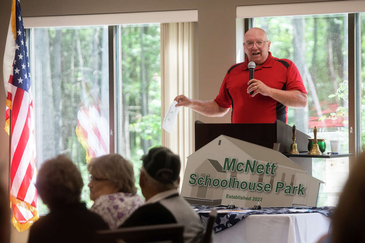 Jerome Township Supervisor Mike Wood speaks about the history of McNett Schoolhouse Park, located next to the Sanford Activity and Dining Center, during a grand opening for the park Wednesday afternoon in Sanford. The park features walking trails and a pickleball court.