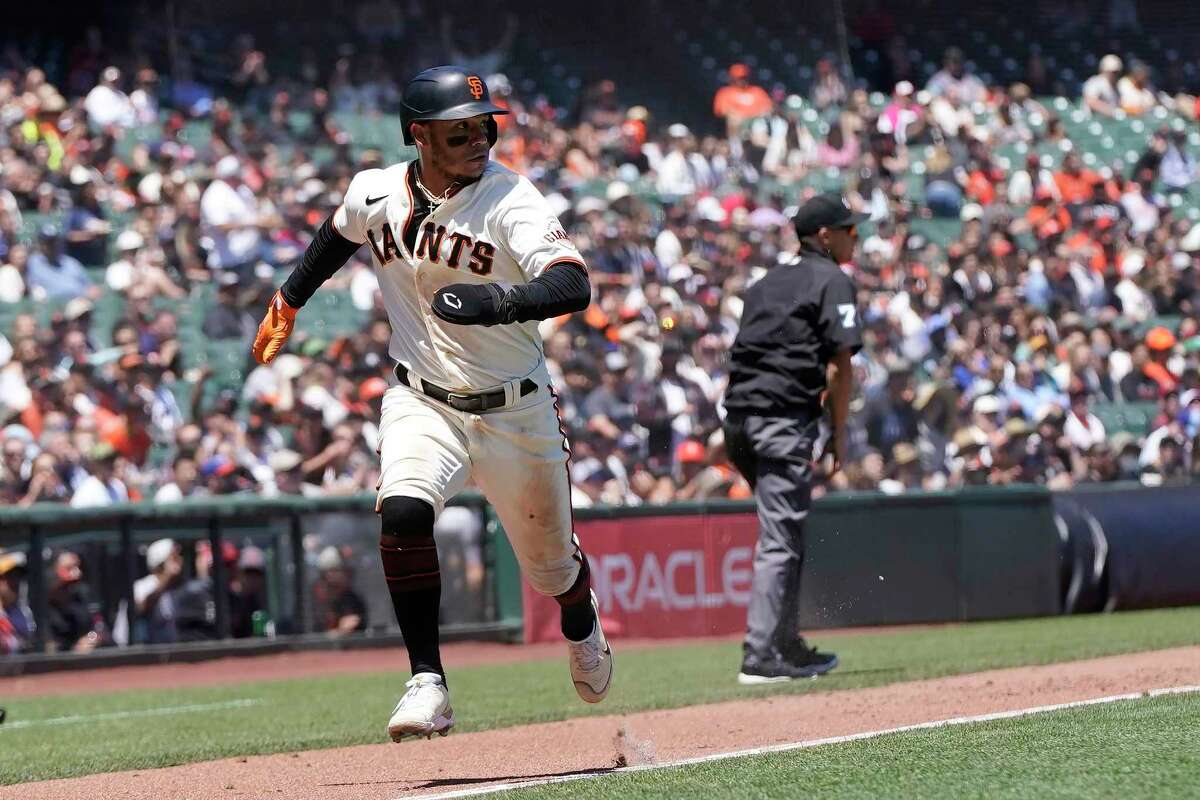 San Francisco Giants' Thairo Estrada runs home to score against the Kansas City Royals during the fourth inning of a baseball game in San Francisco, Wednesday, June 15, 2022. (AP Photo/Jeff Chiu)