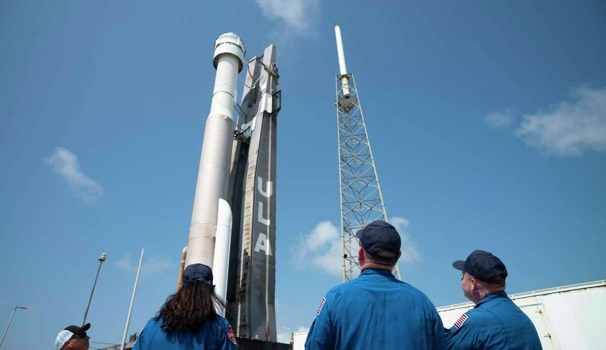 CAPE CANAVERAL, FL - MAY 18: In this handout photo provided by NASA, NASA astronauts (L-R) Suni Williams, Barry "Butch" Wilmore and Mike Fincke watch as a United Launch Alliance Atlas V rocket with Boeing’s CST-100 Starliner spacecraft aboard is rolled out of the Vertical Integration Facility to the launch pad at Space Launch Complex 41 ahead of the Orbital Flight Test-2 (OFT-2) mission on May 18, 2022 in Cape Canaveral, Florida. (Photo by Joel Kowsky/NASA via Getty Images)