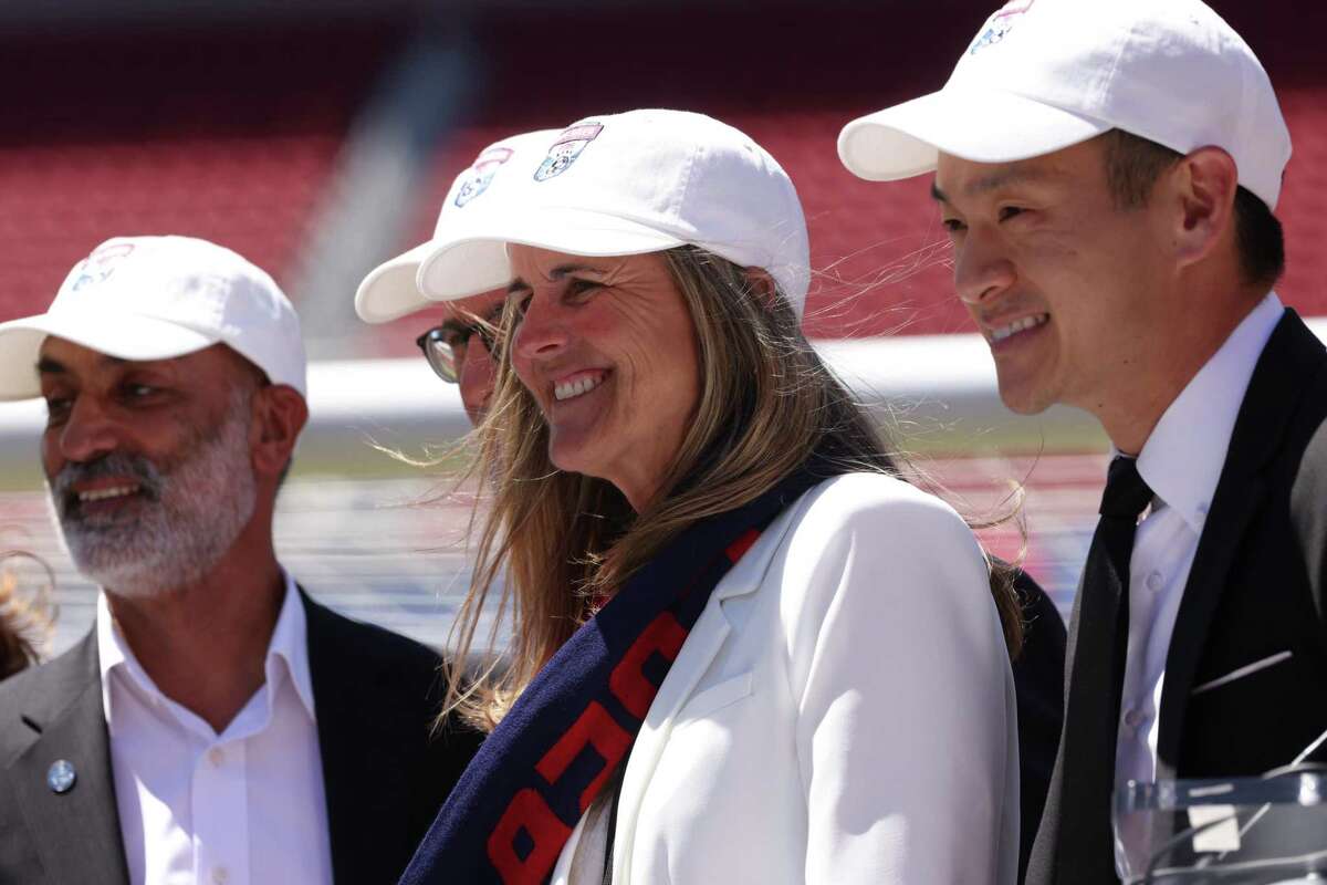 Soccer legend Brandi Chastain poses for photos with other officials following the announcement that San Francisco will be a host city during FIFA World Cup 2026 at Levi’s Stadium on Thursday, June 16, 2022, in Santa Clara, Calif.