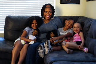 Johnitta Clemons with her granddaughters at home in Bakersfield