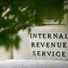 A sign is displayed outside the Internal Revenue Service building May 4, 2021, in Washington.