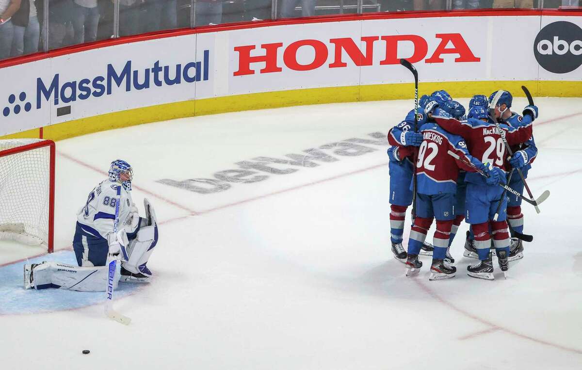 Tampa Bay Lightning goaltender Andrei Vasilevskiy (88) looks on as Colorado Avalanche celebrate a first-period power-play goal by Colorado Avalanche left wing Artturi Lehkonen (62) in Game 1 of the Stanley Cup Final on Wednesday, June 15, 2022 in Denver. (Douglas R. Clifford/Tamps Bay Times/TNS)