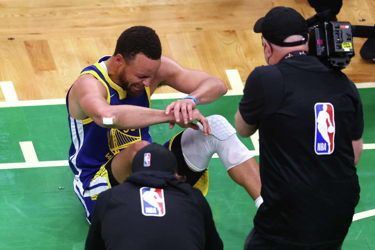 Warriors #39 Curry cries on court after Golden State wins NBA Finals