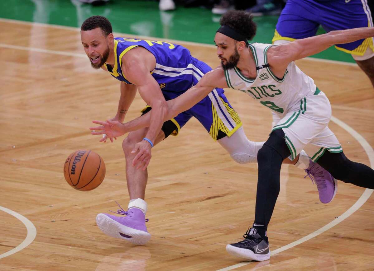 Golden State Warriors' Stephen Curry, 30, and Boston Celtics' Derrick White, 9, chase the ball during the second quarter in Game 6 of the NBA Finals at TD Garden in Boston, Mass., on Thursday, June 16, 2022.