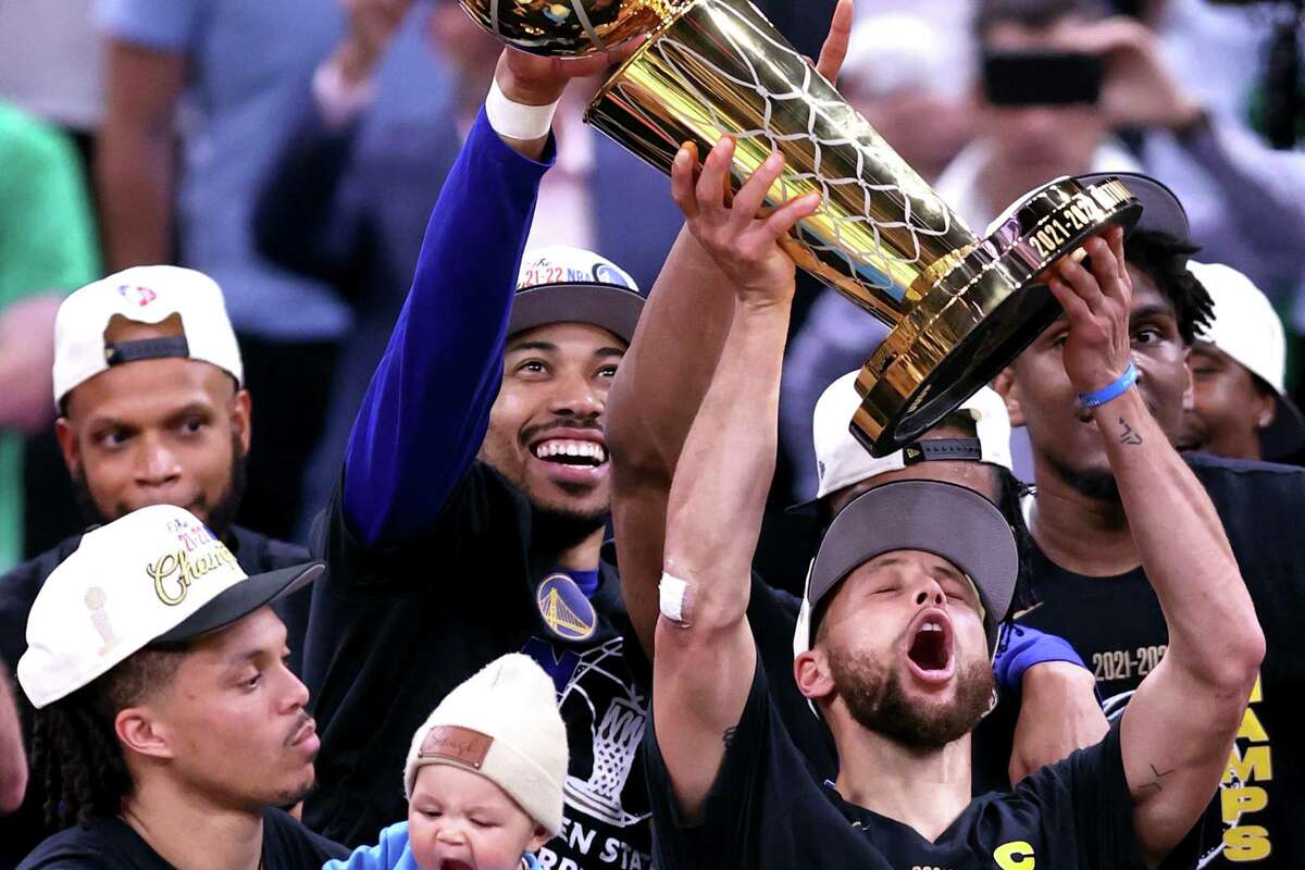 Golden State Warriors’ Stephen Curry raises the Larry O’Brien Trophy after Warriors won NBA Championship with a 103-90 win over Boston Celtics in Game 6 of NBA Finals at TD Garden in Boston Mass., on Thursday, June 16, 2022.