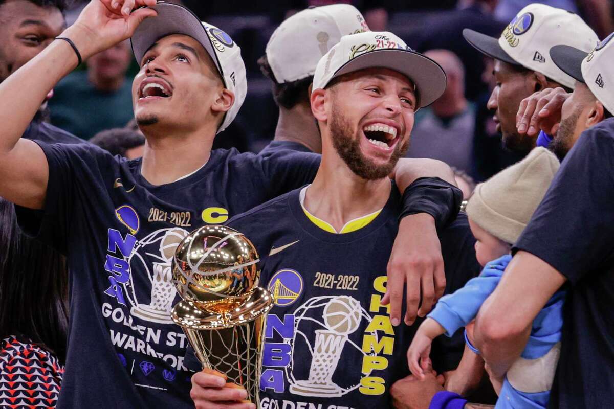 Golden State Warriors' Stephen Curry, 30, holds the Bill Russell NBA Finals Most Valuable Player Award after the Golden State Warriors defeated the Boston Celtics 103 to 90 Game 6 to win the NBA Finals at TD Garden in Boston, Mass., on Thursday, June 16, 2022.