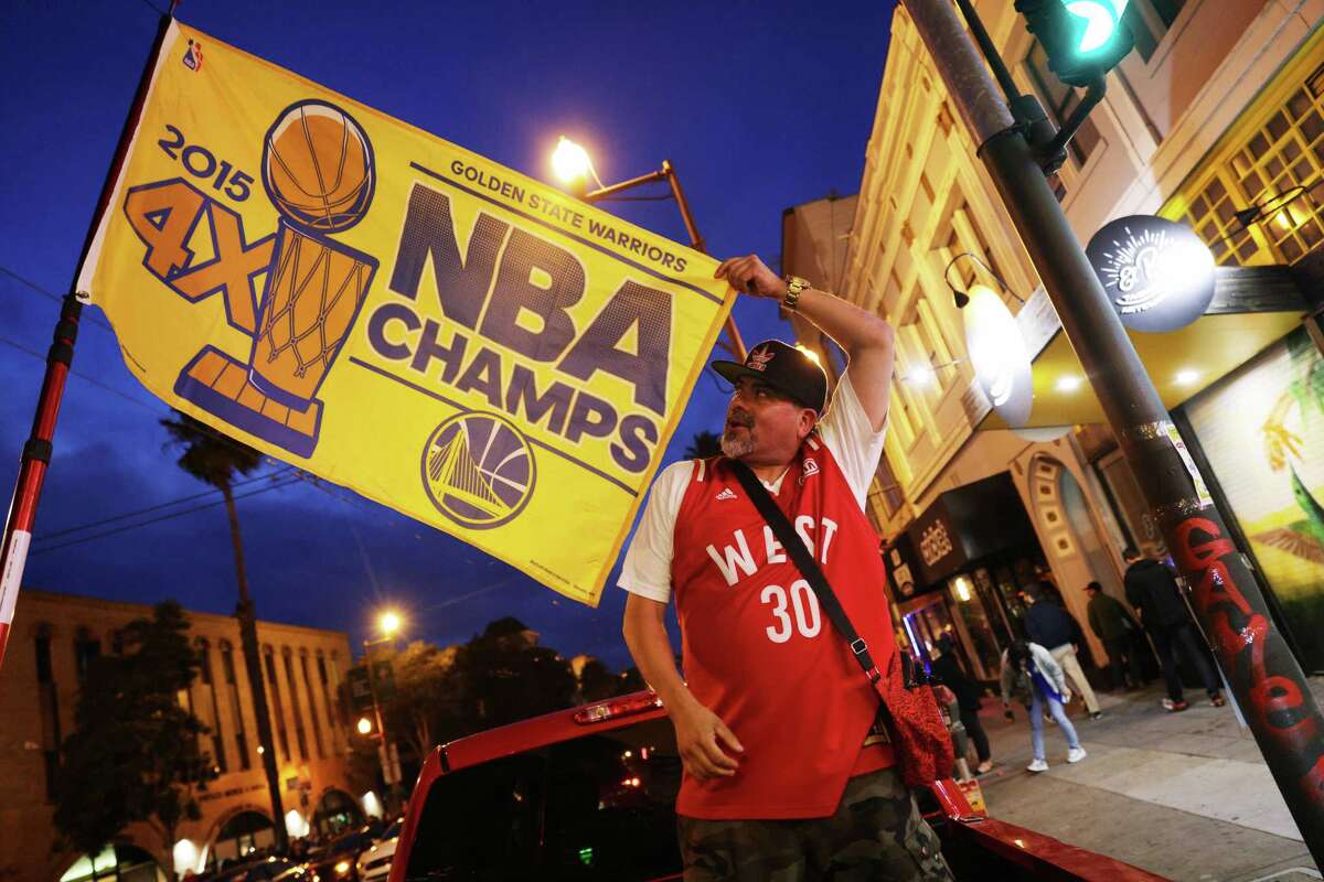 Joyous fans spill into S.F., Oakland streets to celebrate Warriors NBA