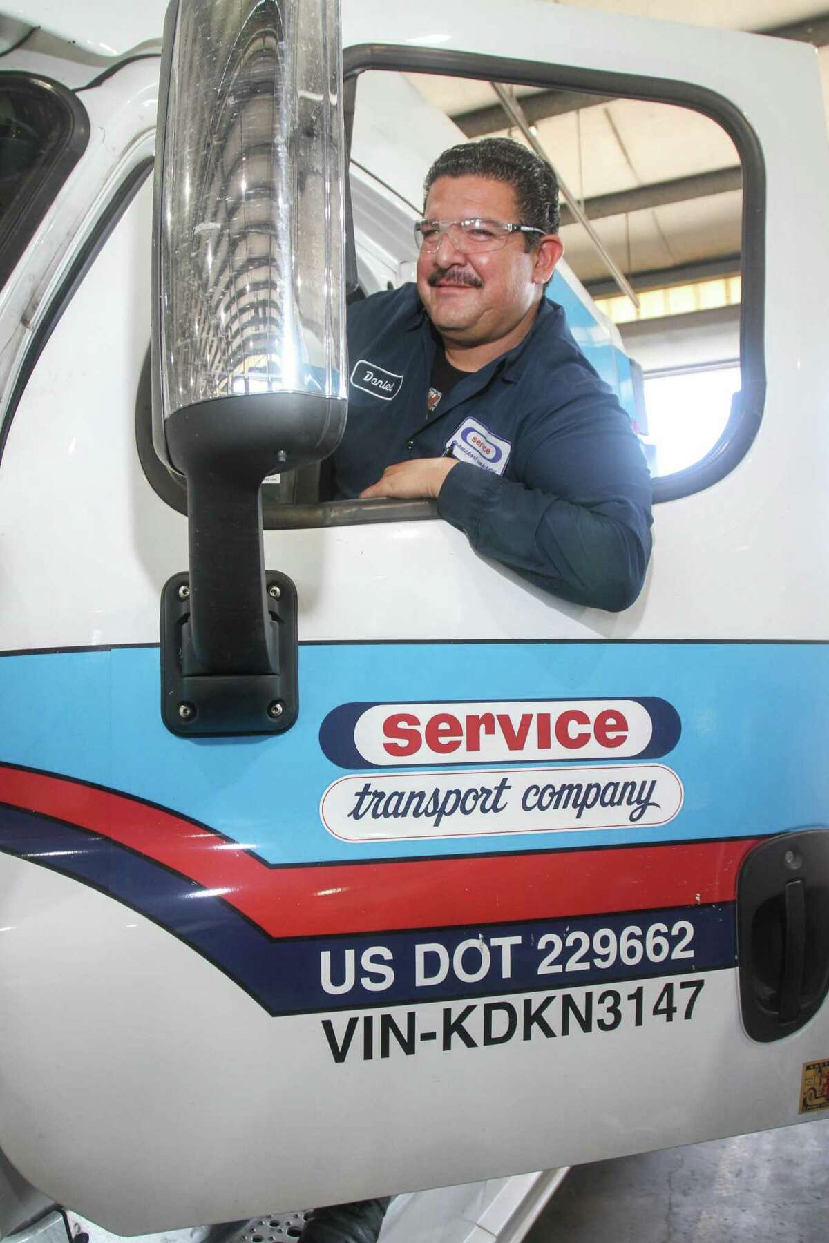 Mechanic Daniel Rodriguez in truck cab after checking out the truck interior at Service Transport, in Houston on June 3, 2022.