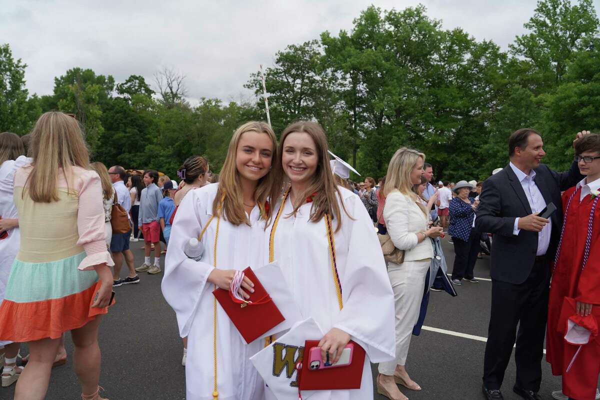 Anna Grzymski and Anna Barnard stood outside the school, happy to have graduated from New Canaan High School on June 16, 2022.