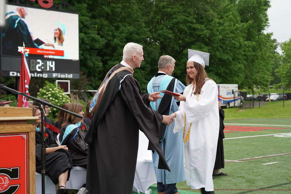 New Canaan High School Principal William Egan congratulated Olivia Quinn as she graduated on June 23, 2022.