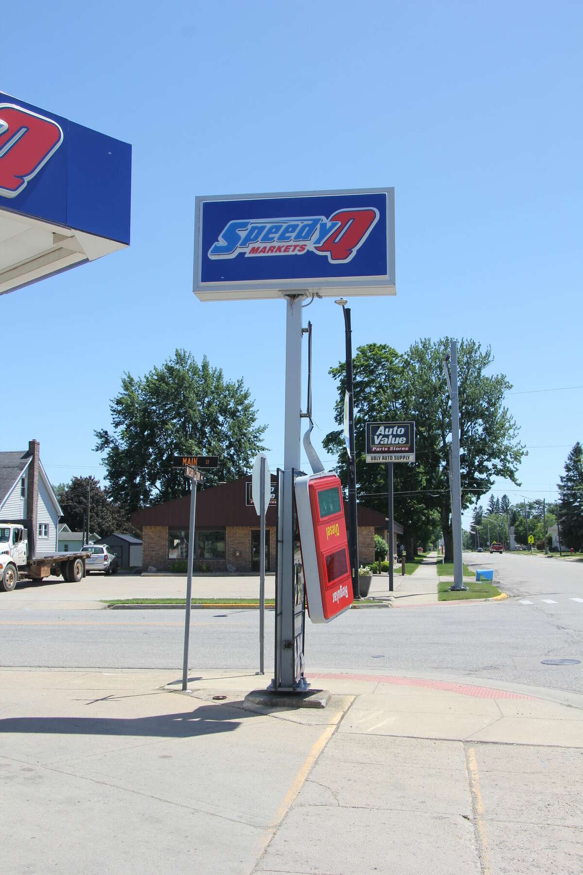 An unfortunate gas station sign was damaged by the strong winds.