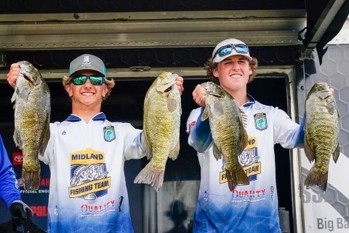 Midland High's Brady Pinwar (left) and Alec Albrecht display four of the fish they snagged while winning a second straight Bassmaster High School Series national championship on Saginaw Bay last Saturday, June 11, 2022.