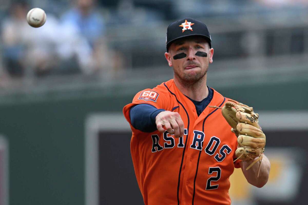 Houston Astros third baseman Alex Bregman throws out the Kansas City Royals' Whit Merrifield at first base during the first inning of a game, Sunday, June 5, 2022 in Kansas City, Mo.