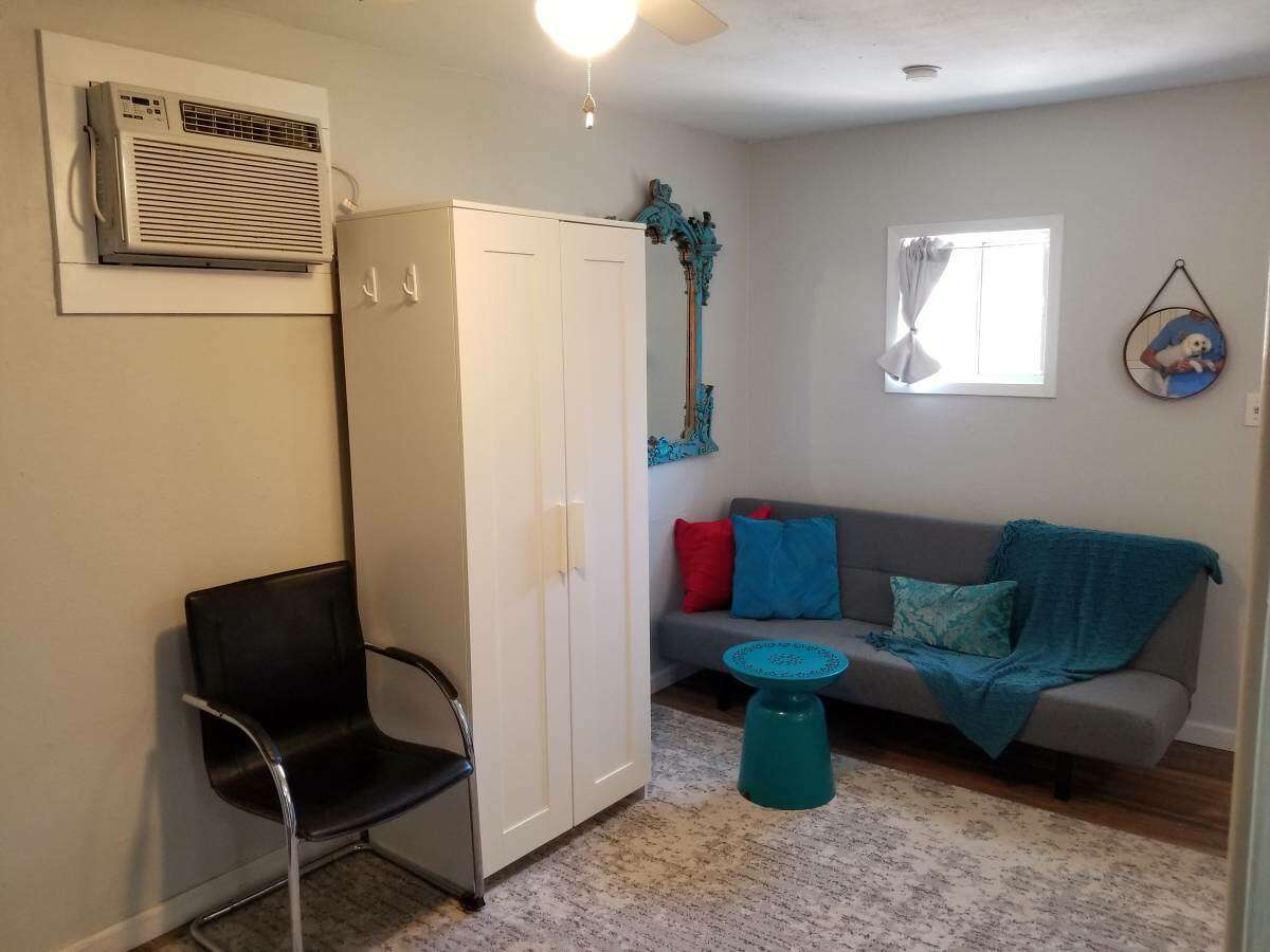 You can literally swing around to find your living room space with what looks like a wardrobe and a couch.