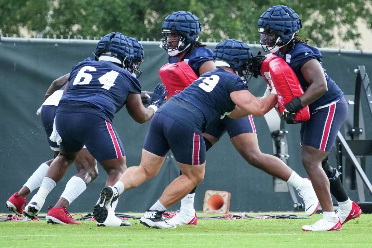 Houston Texans offensive linemen Justin McCray (64) and Jimmy Morrissey (79) run a blocking drill during mini camp Wednesday, June 15, 2022, at Houston Methodist Training Center in Houston.