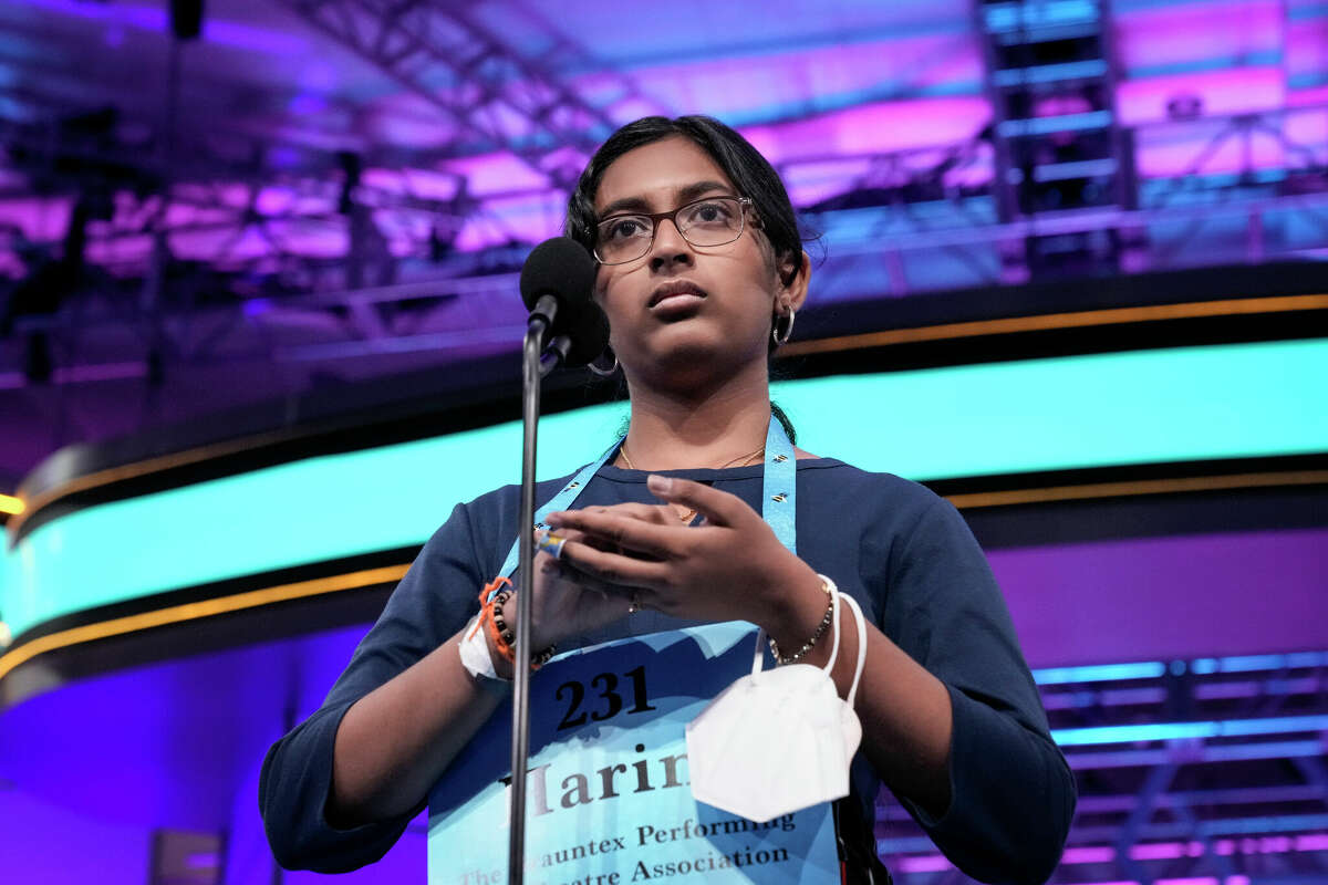 14-year-old Harini Logan from San Antonio, Texas uses her hand to write a word during the final round of the Scripps National Spelling Bee at the Gaylord National Harbor Resort on June 2, 2022 in Oxon Hill, Maryland.