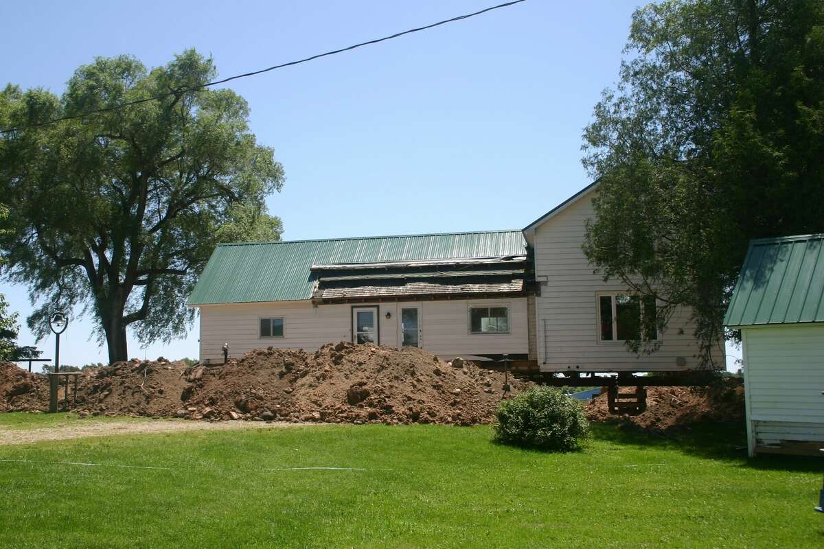 The Doyle farmhouse along Northland Drive, south of Big Rapids was lifted off it's foundation in order to pour a new foundation and add a basement to help preserve the 100 year old structure.