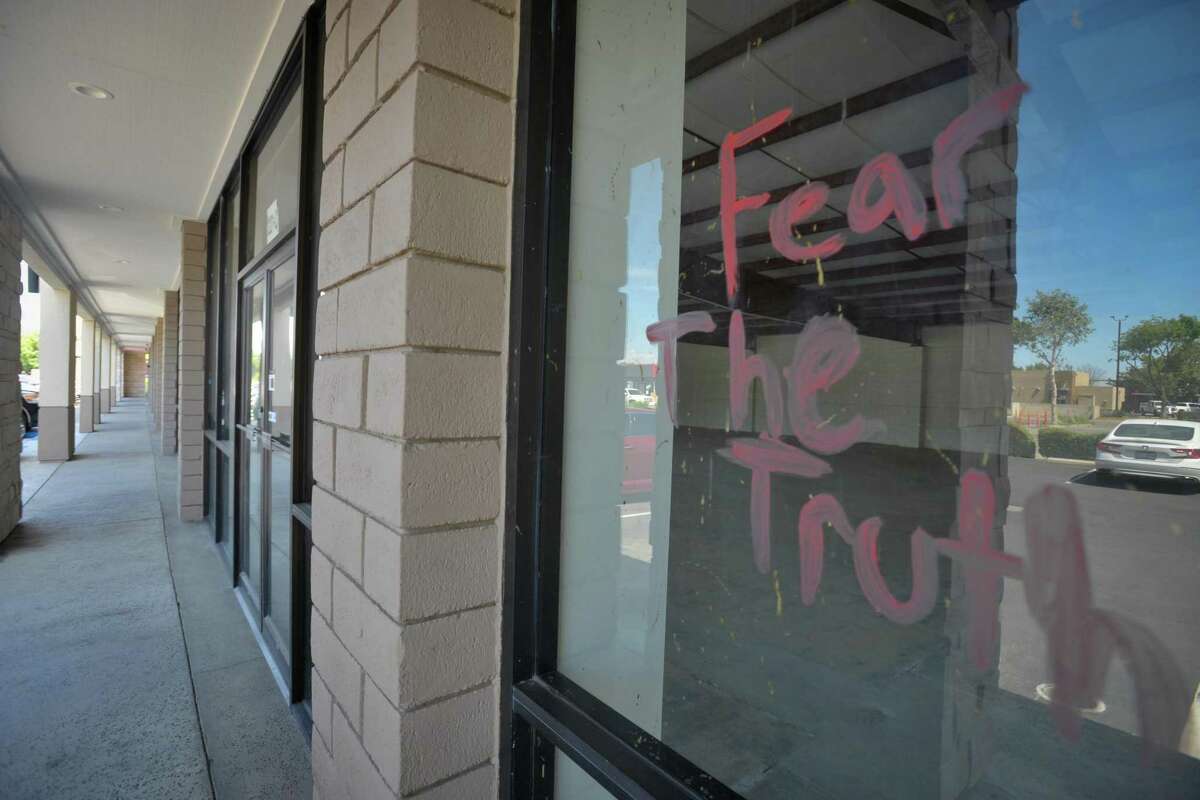 The words "Fear The Truth" are written on an empty storefront window of the commercial building where residents and business owners recently defeated an expansion plan for a Planned Parenthood clinic at 3221 S. Mooney Blvd in Visalia, Calif., on Monday afternoon, June 6, 2022. With the landmark abortion case Roe v. Wade seemingly on its last legal legs, pro-life activists are mobilizing to stunt new statewide maternal rights laws and grassroots networks are working to expand access to health care that has long been elusive for poor and non-white pregnant people.