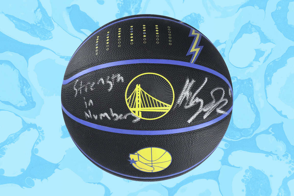 A ball autographed by Klay Thompson with the phrase "Strength in Numbers" signed on it is up for auction on Fanatics.
