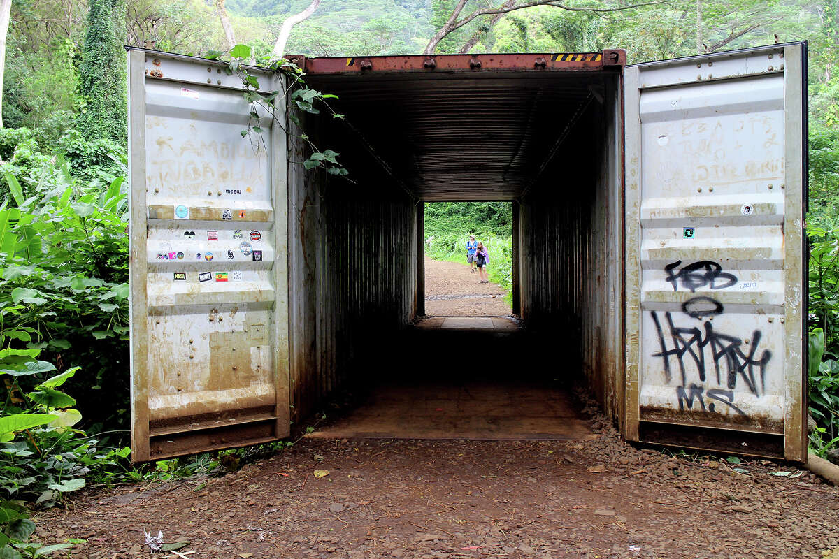 The trail takes hikers through an old shipping container.