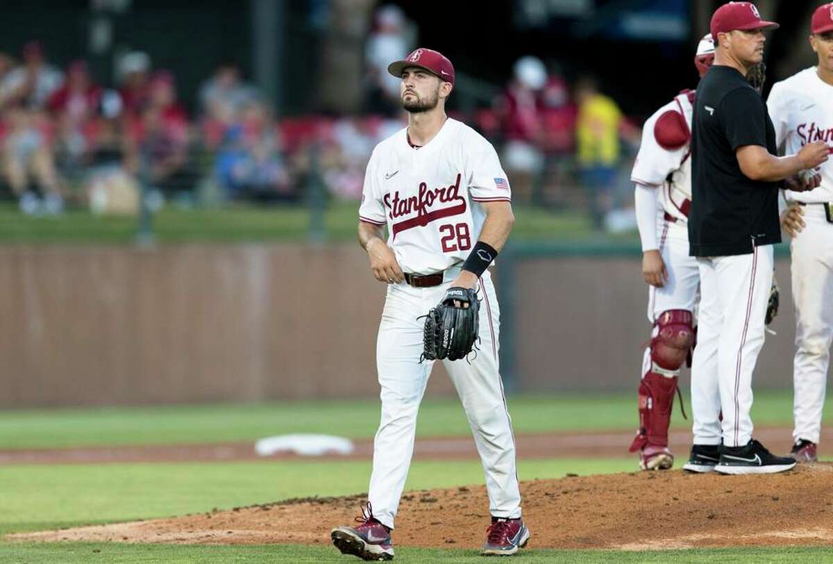 Stanford pitcher Alex Williams (28) walks off the field after being replaced during the second inning of an NCAA college baseball tournament super regional game against Connecticut, Saturday, June 11, 2022, in Stanford, Calif. (AP Photo/John Hefti)