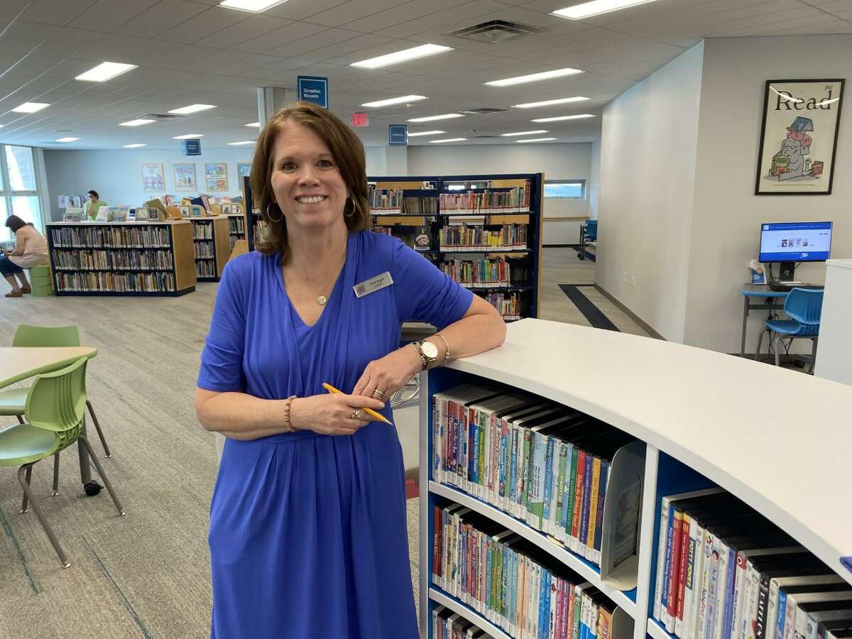 Milford Public Library Director Christine Angeli in the building's new children's department. The library has made a survey available seeking the public's comment on its services and what changes, if any are needed.