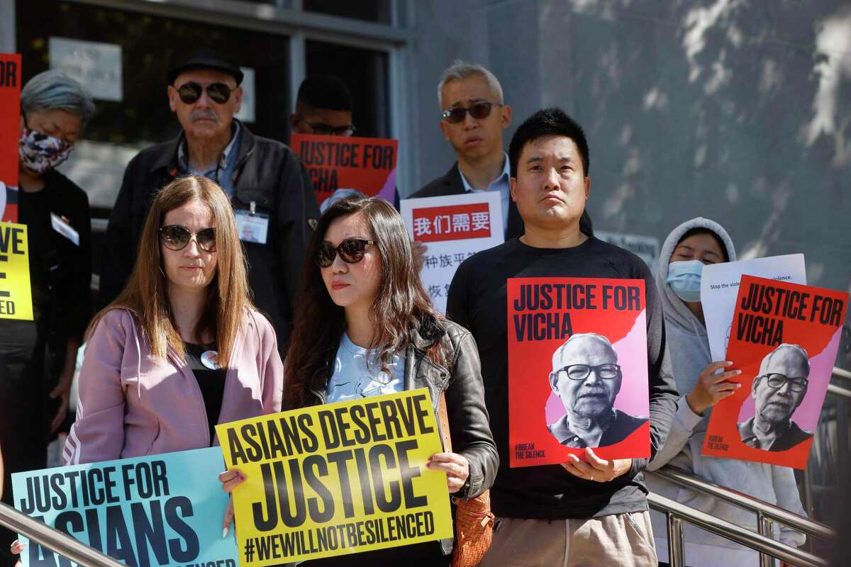 Demonstrators hold signs during a rally this month demanding justice for Vicha Ratanapakdee, who died after being assaulted in San Francisco in January 2021.