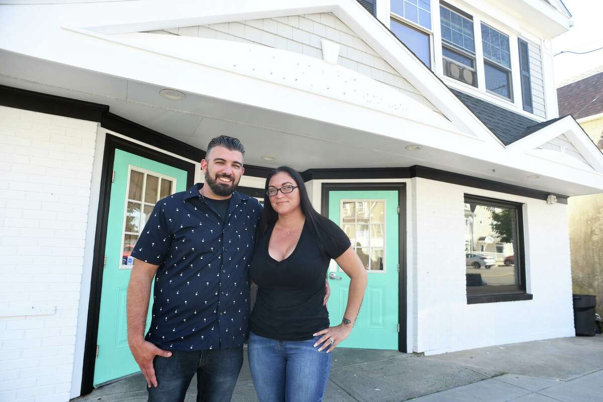 Nick Amoratis and Crystal Ardito-Meyer pose in front of 54 Naugatuck Ave., the future location of Nautilus Restaurant, in Milford, Conn. June 14, 2022.