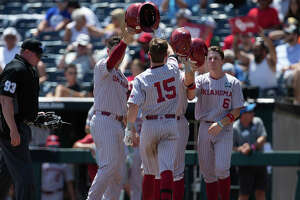 Oklahoma douses Texas A&M in CWS opener