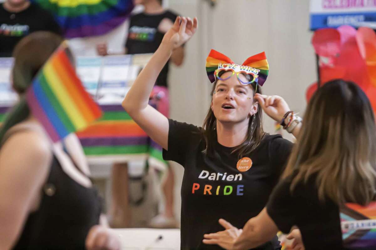 Darien resident Stacey Tié celebrates during the first-ever Pride rally in town history.