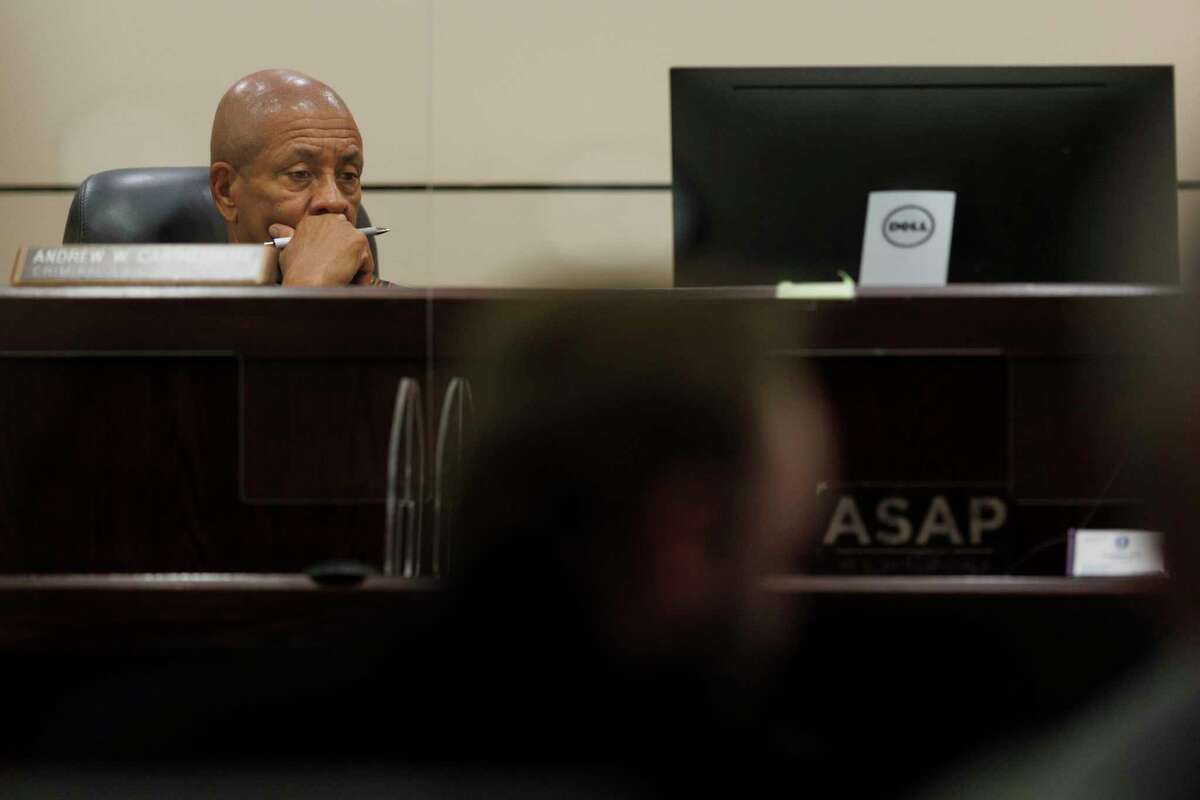 Judge Andrew Carruthers listens to testimony Friday during a hearing on whether to overturn the 1991 conviction of Melvin George Quinney Jr., who was found guilty of indecency with a child and sentenced him to 20 years in prison. His son, who was 10 at the time, has recanted his testimony in an effort to exonerate his father.