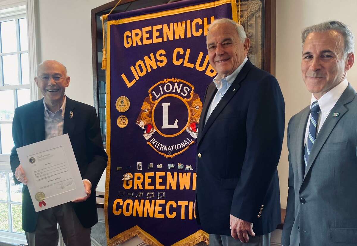 The Greenwich Lions Club honors Gifford Reed, left, for his decades of service to the nonprofit. He is joined by Greenwich Lions President Robert Frishman, center, and First Selectman Fred Camillo, right, at a ceremony at the Riverside Yacht Club.